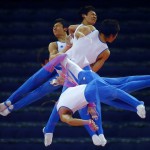 South Korea's Kim Soo-myun rotates above the horizontal bar during men's gymnastics podium training before the 2012 London Olympic Games in London July 25, 2012.   REUTERS/Mike Blake  (BRITAIN - Tags: SPORT OLYMPICS GYMNASTICS)
